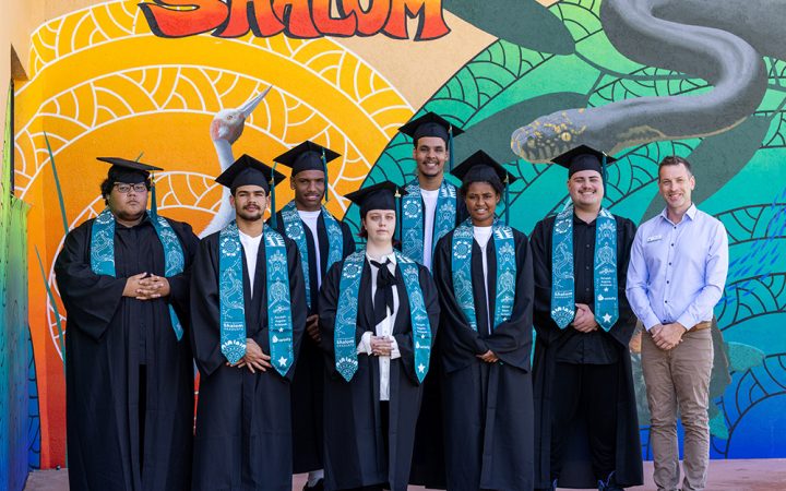 Carinity Education Shalom Year 12 graduates with Stuart Todd, Head of Secondary at the Townsville school