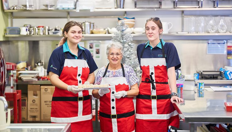 Carinity Education Southside students and Carinity Wishart Gardens resident, Margie Hyde, make some Christmas treats